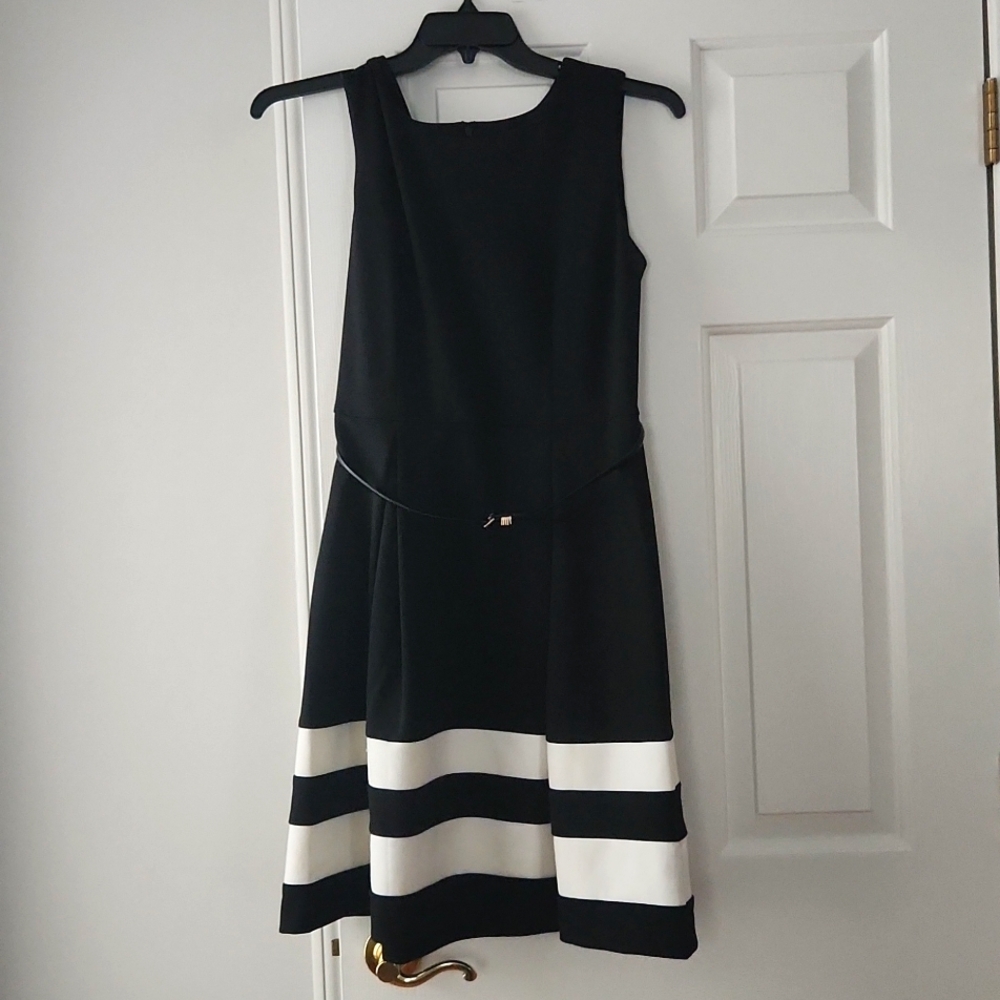 Black dress with white stripes and black belt